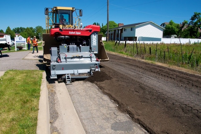 Asphalt Zipper reclaiming asphalt on AggreBind road project