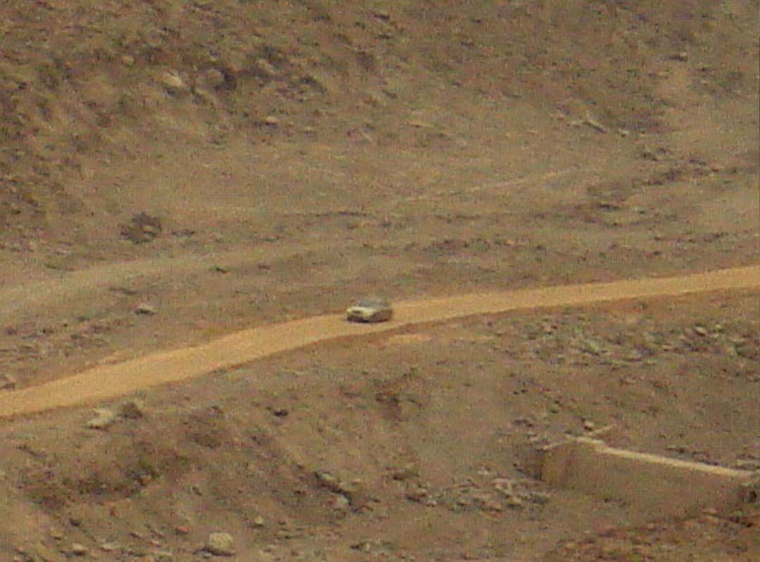 A car on an AggreBind project mining access road